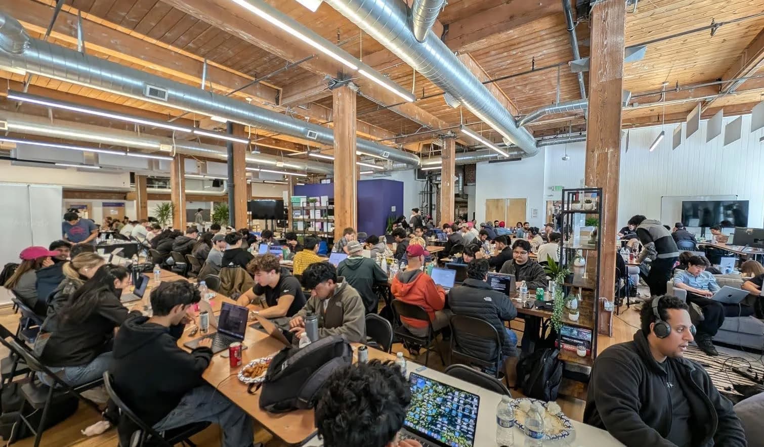 Founders and builders working together during a large professional session