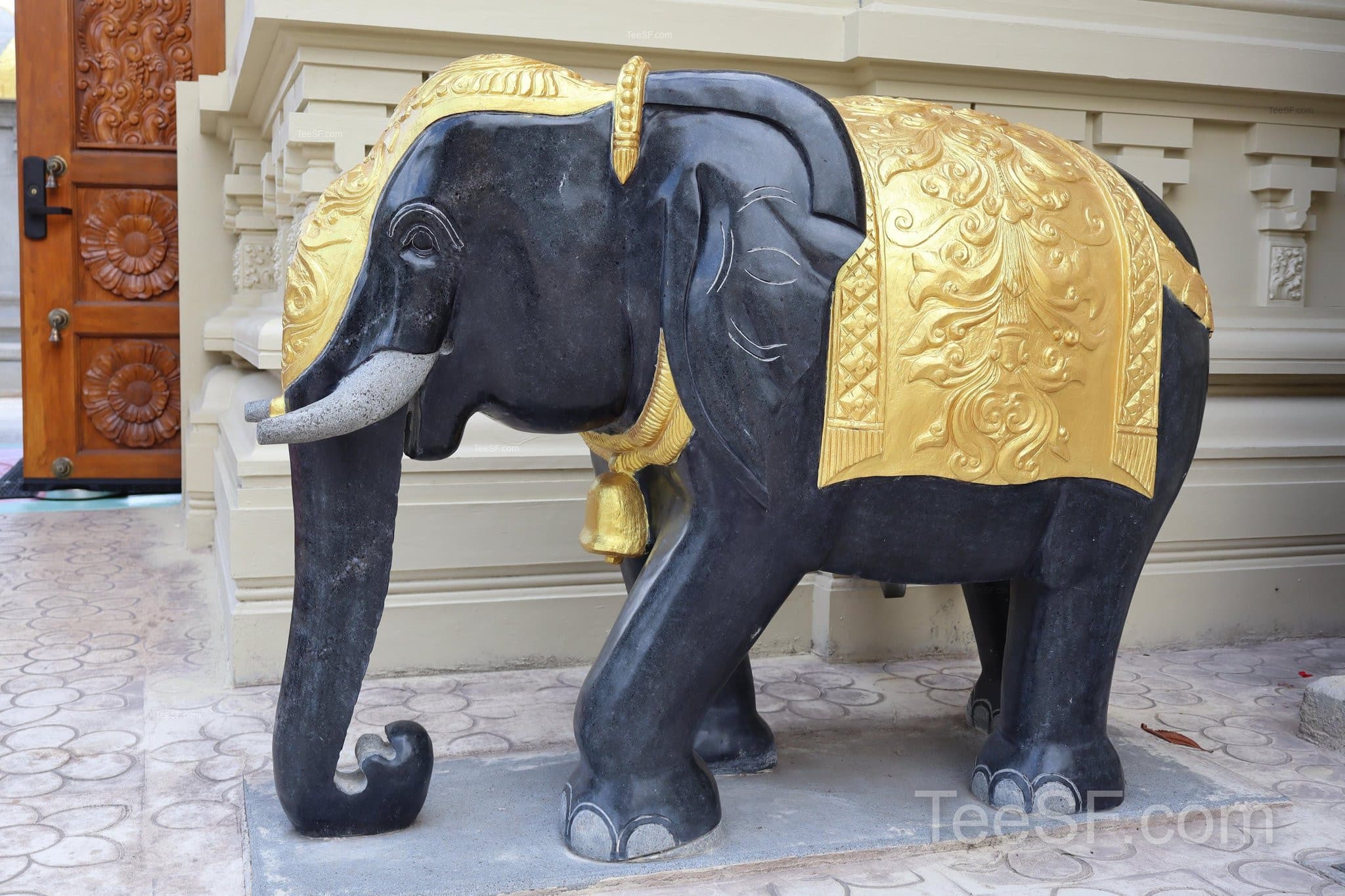 Black and gold elephant statue at Shiva Murugan Temple in Concord
